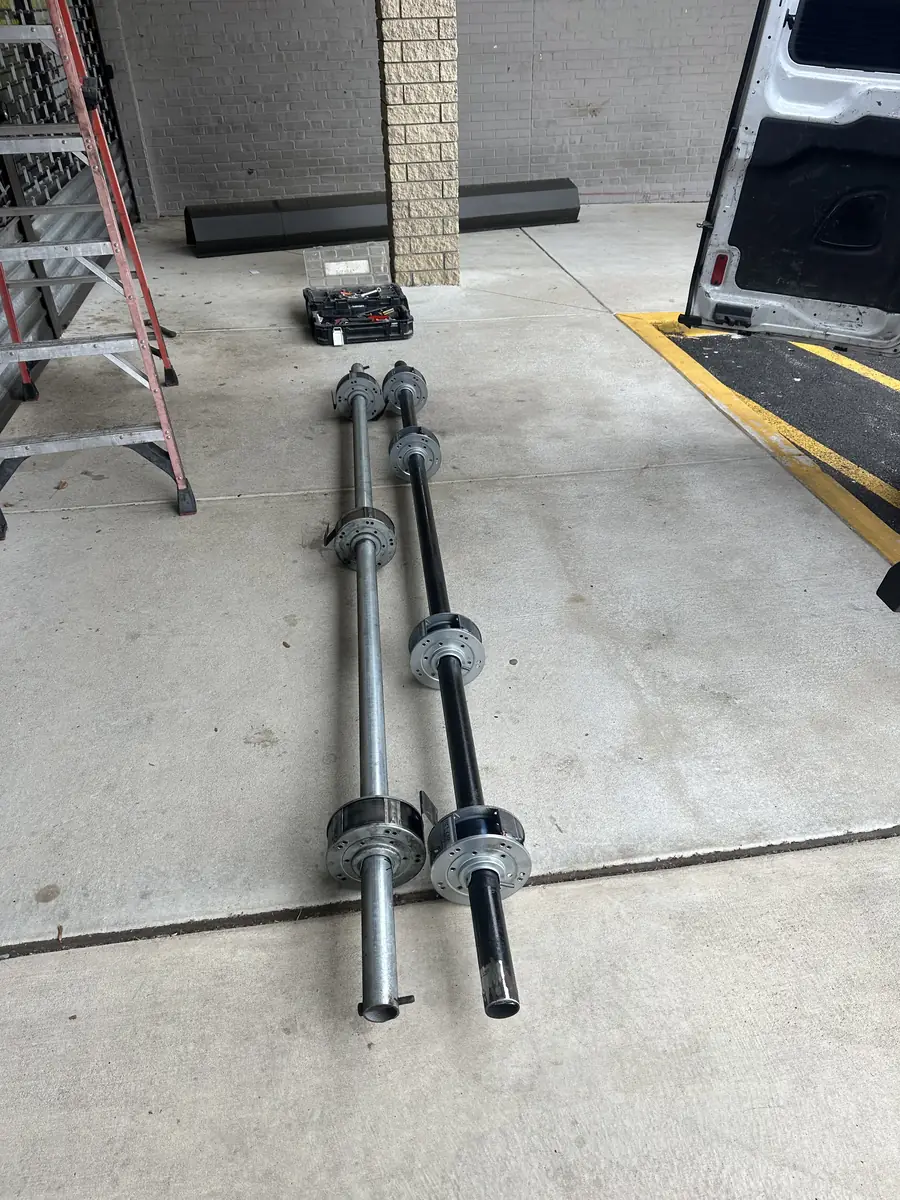 Garage door torsion springs, shafts and cable drums ready for replacement — American Best Garage Doors